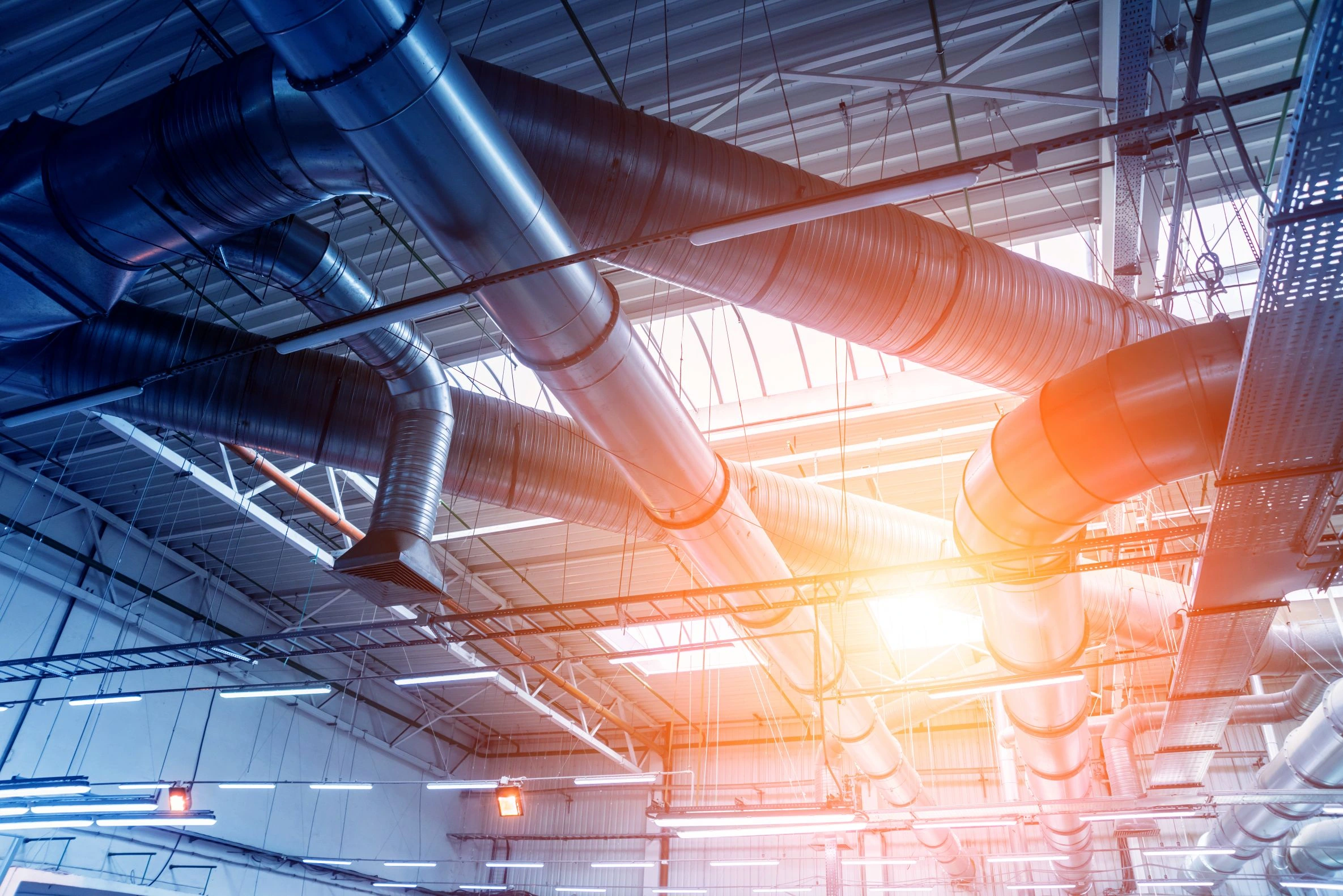 Air conditioning ducts and pipework inside a commercial building